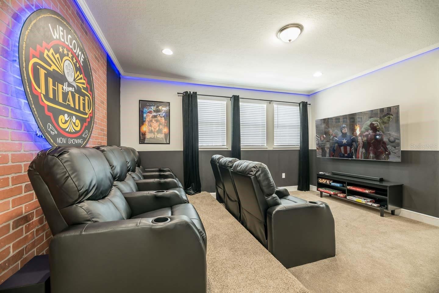 movie room with multilevel chairs